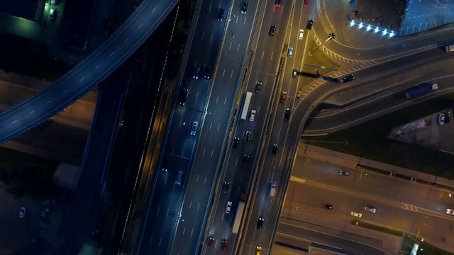 System of road intersections on a night highway. View from above.