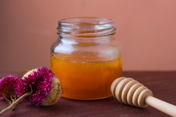 Wild honey in glass jar
