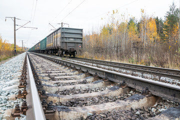 Obraz premium Railway road and trees in yellow colors