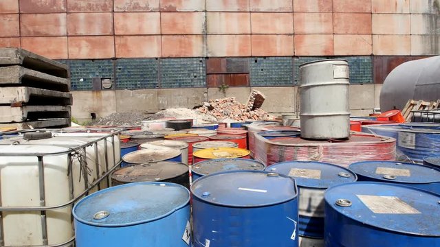 Barrels stand with waste oil and oil products