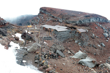 Steep Terrain on climbing route during storm on Mount Fuji, a symmetrical volcano and tallest peak in Japan which is one of the most popular mountains in the world to climb © nyker