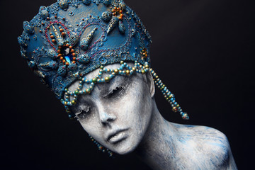 Woman in creative blue crown