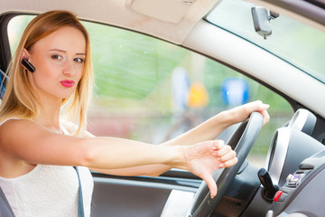 Fototapeta na wymiar woman driving car annoyed by heavy traffic
