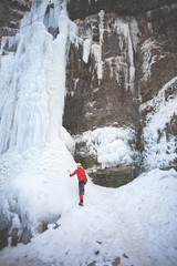 The climber climbs on ice.