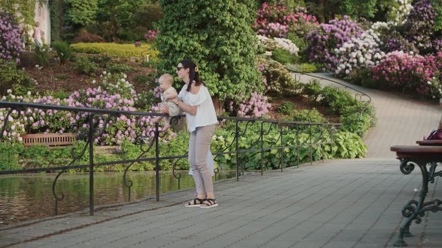 Pretty young woman enjoying spare time with her children