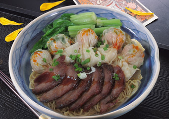 Chinese noodle soup with wonton and honey pork.
