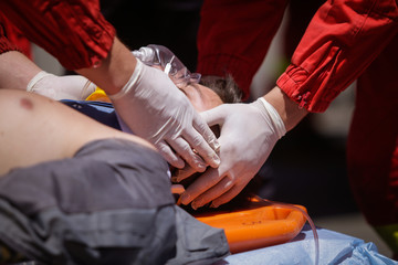 Paramedics rescue the victim of a drill car crash