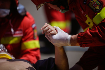 Paramedics rescue the victim of a drill car crash
