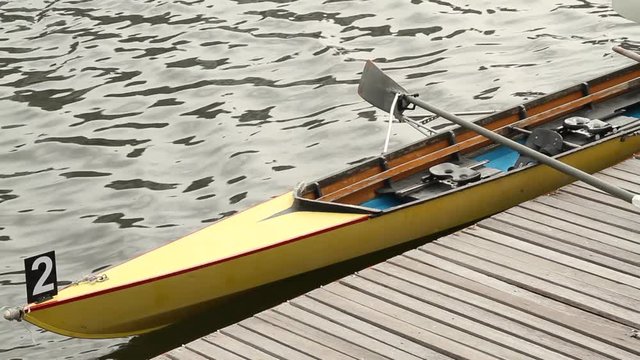Rowing boat tied to a pier
