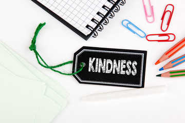 Kindness. Price tag with string on a white background.
