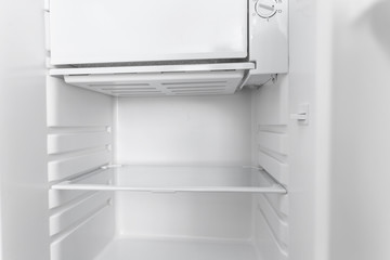 White open empty refrigerator.