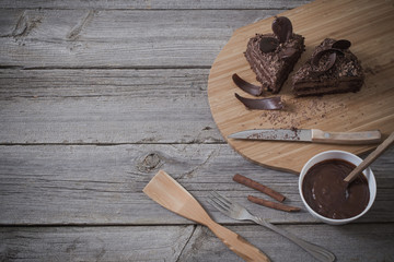 Chocolate cake on old wooden table