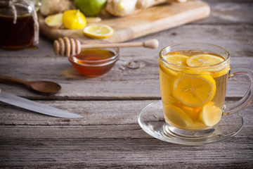  Ginger tea and ingredients on a  grunge wooden background