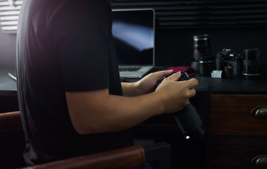 Photographer working checking photo ,Stylish home studio concept of hipster . Seleted focus.