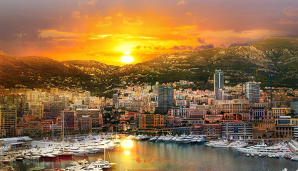 Monaco at sunset. Main marina of Monte Carlo with luxury yachts and sail boats at sunset - obrazy, fototapety, plakaty