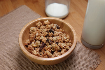 Bowl of cereal breakfast in wooden bowl
