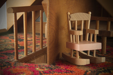 Fototapeta na wymiar Doll House Rocking Chair And Staircase