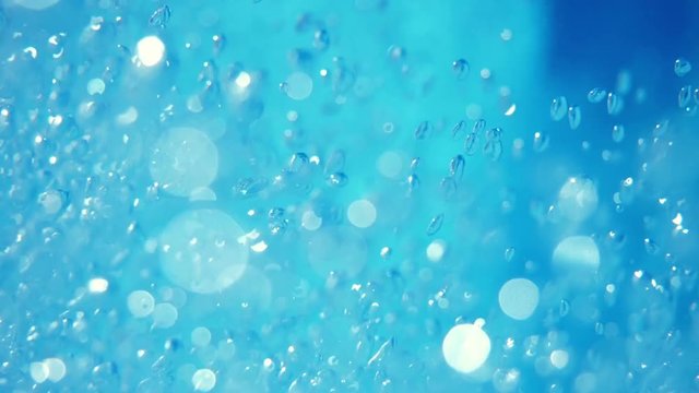 Bubbles rising to the surface. Air bubbles in water in sea (underwater shot), good for backgrounds. Slow motion.
