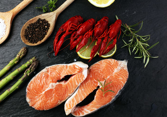 tasty boiled crawfish closeup on stone table, seafood dinner, nobody