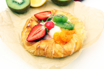 danish pastry with strawberry, kiwi and tangarine