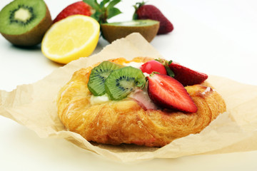 danish pastry with strawberry, kiwi and tangarine