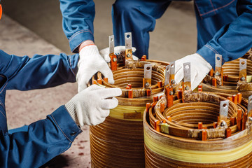 Manufacturing of high voltage transformer in the production workshop. - obrazy, fototapety, plakaty
