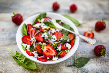 Delicious and healthy strawberry salad and spinach with blue cheese.
