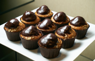 Set of Tasty chocolate frosting cakes isolated on white.