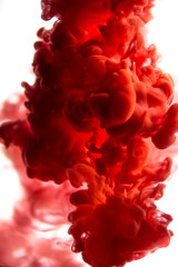 red ink in water isolated on white background