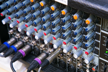 Fototapeta premium Buttons and tabs in various parts of the audio controller mixer ,music,mixer in studio,audio sound mixer with buttons and sliders