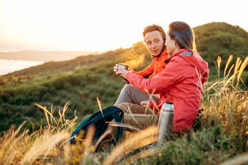 Traveler couple rests outdoor.