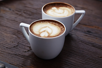 Two white cups of coffee