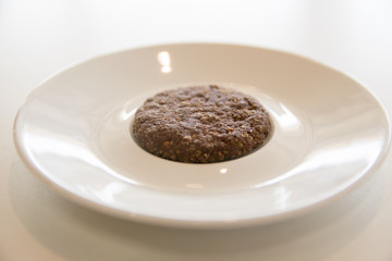 Chocolate cashew nut butter cookie on white plate