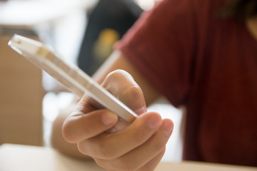 hands using a phone texting on smartphone app