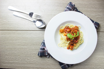 Spaghetti bolognese pasta with tomato sauce,homemade healthy italian pasta on wooden background
