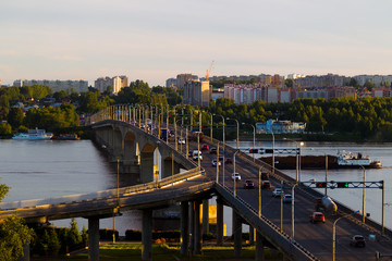 Obraz premium Summer city landscape with a bridge over the river