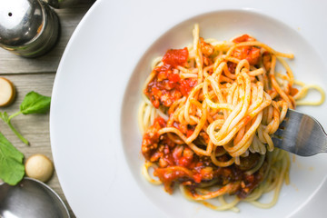 Spaghetti bolognese pasta with tomato sauce,Fork holding spaghetti