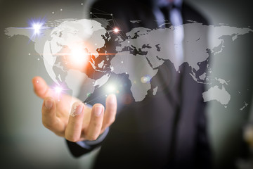 Businessman holding global network and data exchanges over the world