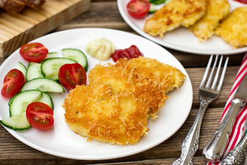 Homemade chicken nuggets with cheese and bread crumbs