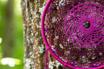 Dreamcatcher made of feathers, leather, beads, and ropes