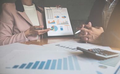 Business team meeting present. Professional investor working with new startup project. Digital tablet laptop computer design smart phone in office.