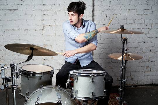 the drummer behind the drums