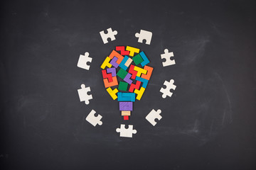 Business creative solution concept jigsaw on the blackboard