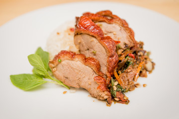 stir-fried roasted duck and basil and fried egg with rice, Thai food