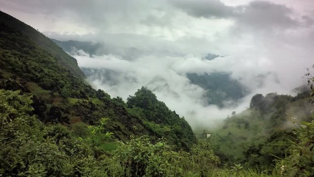 4K Low clouds roll in through the mountains of North Vietnam in province Ha Giang