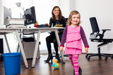 Working Mom And Daughter At The Office
