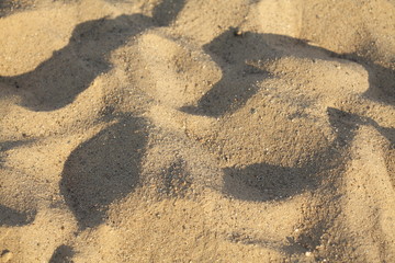 Sand mit Schatten an einem Strand