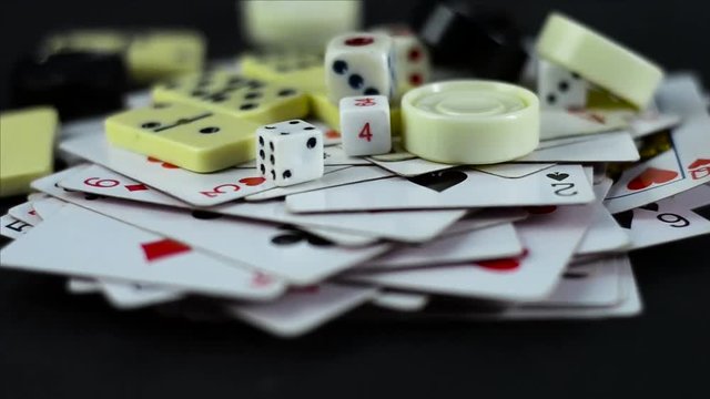 Various board games chess board, playing cards, dominoes. Hobby. Metaphor for games and gambling.