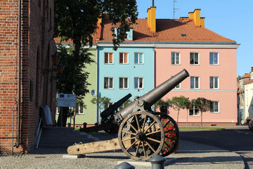 Morag, Poland  - August 1, 2015 - a cannon in front of a town hall in summer