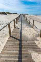 Beach path between sand dunes at Costa Nova beach. Aveiro.  Portugal